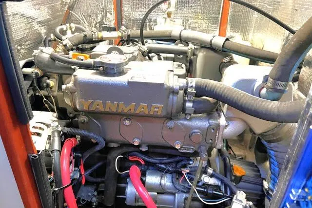Slide: The Image of Engine compartment of a 2015 Blue Jacket 40 sailboat featuring a Yanmar engine. - 48