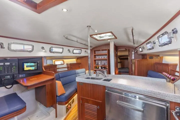 Slide: The Image of Luxurious interior of 2015 Blue Jacket 40 sailboat with modern amenities and wood finishes. - 5