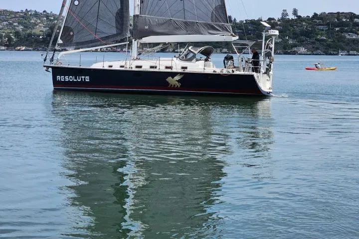 Slide: The Image of Sailboat "Resolute" on calm water, Blue Jacket 40 model, 2015. - 52