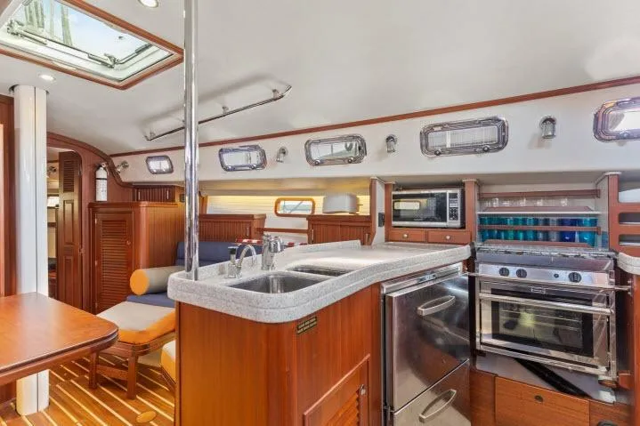 Slide: The Image of Luxurious interior of 2015 Blue Jacket 40 sailboat with modern kitchen and seating area. - 9