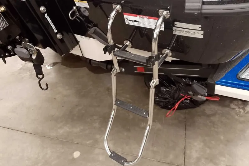 Slide: The Image of Stainless steel ladder on 2026 Ranger 620FS Cup-Equipped boat, garage setting. - 10