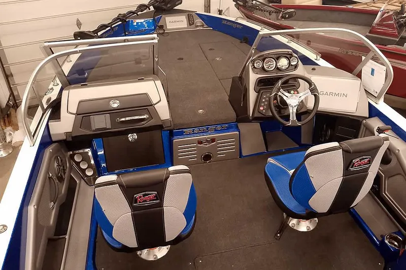 Slide: The Image of 2026 Ranger 620FS Cup-Equipped boat interior with dual seats and Garmin dashboard. - 11