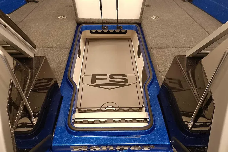 Slide: The Image of 2026 Ranger 620FS Cup-Equipped boat interior with storage compartment and sleek design. - 12