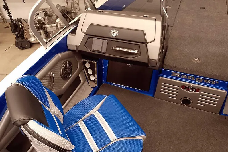 Slide: The Image of 2026 Ranger 620FS Cup-Equipped boat interior with blue seating and modern dashboard. - 23
