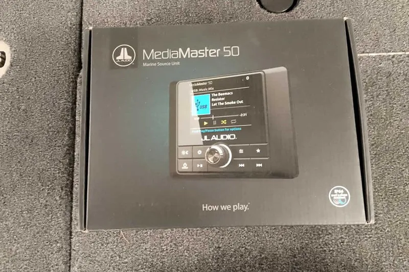 Slide: The Image of Box of JL Audio MediaMaster 50 marine source unit on Ranger 620FS Cup-Equipped, 2026 model. - 26