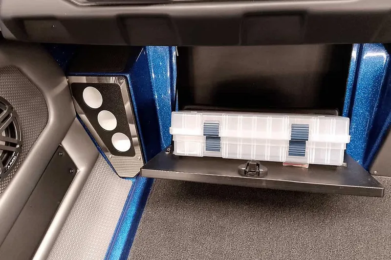 Slide: The Image of 2026 Ranger 620FS Cup-Equipped interior storage with tackle box and speaker detail. - 27