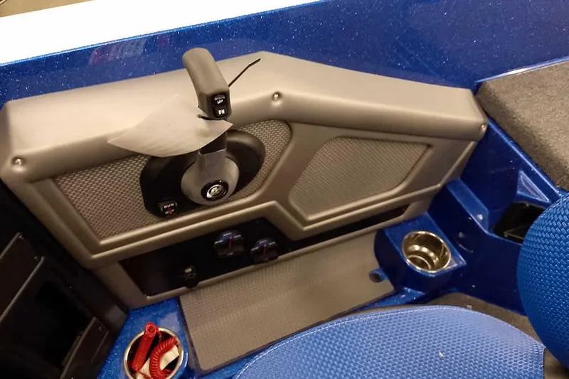 Slide: The Image of 2026 Ranger 620FS Cup-Equipped boat interior with control panel and cup holder. - 31