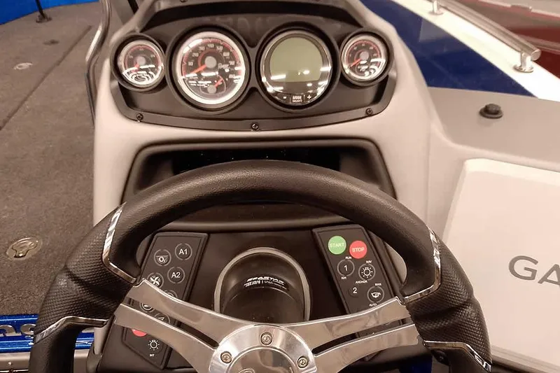 Slide: The Image of Dashboard of 2026 Ranger 620FS Cup-Equipped boat with steering wheel and gauges. - 33