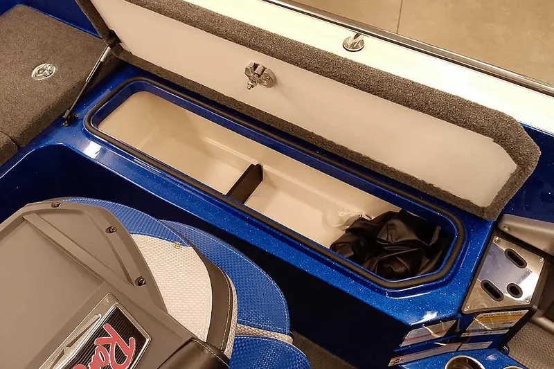 Slide: The Image of 2026 Ranger 620FS Cup-Equipped boat interior storage compartment, open lid, blue finish. - 37