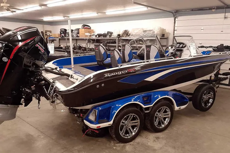 Slide: The Image of 2026 Ranger 620FS Cup-Equipped boat in showroom, featuring sleek design and powerful engine. - 45