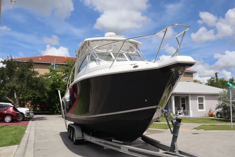 Slide: The Image of 2007 Pro-Line 32 Express boat on trailer, blue sky. - 1