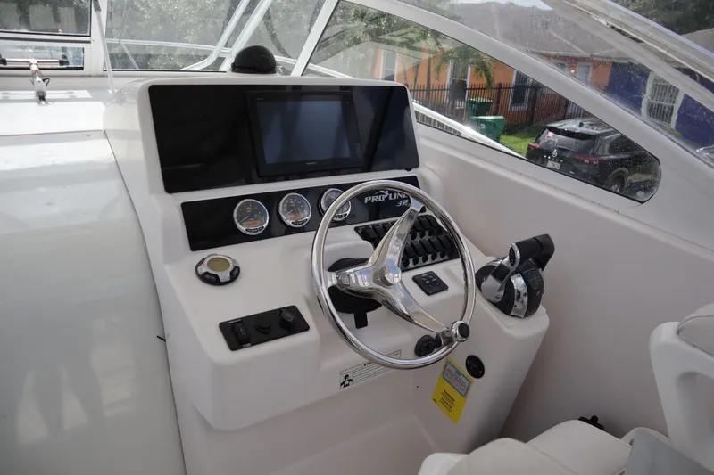 Slide: The Image of 2007 Pro-Line 32 Express helm with instruments and controls. - 12