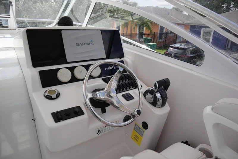Slide: The Image of 2007 Pro-Line 32 Express helm with Garmin navigation system. - 13