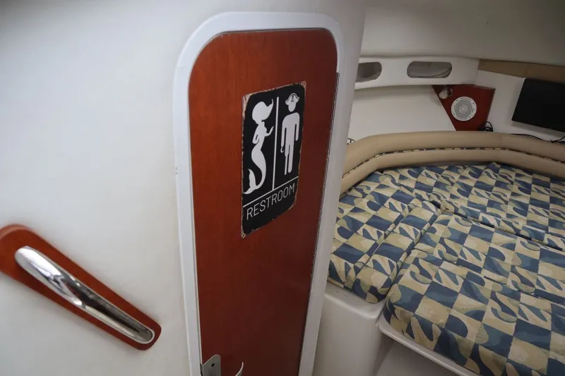 Slide: The Image of 2007 Pro-Line 32 Express cabin with restroom sign. - 17