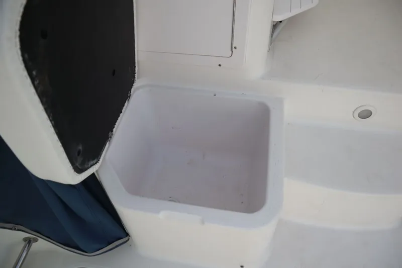 Slide: The Image of Open storage compartment on a 2007 Pro-Line 32 Express boat. - 22