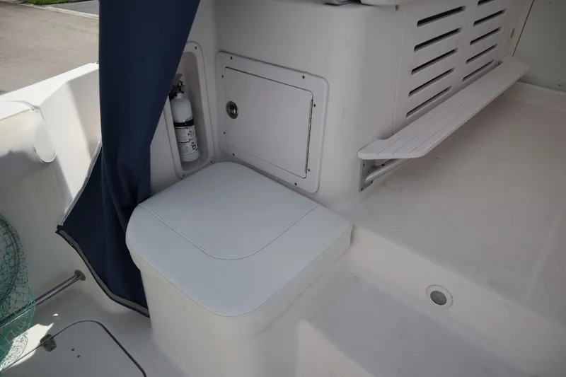 Slide: The Image of Interior of a 2007 Pro-Line 32 Express boat with seat and fire extinguisher. - 23