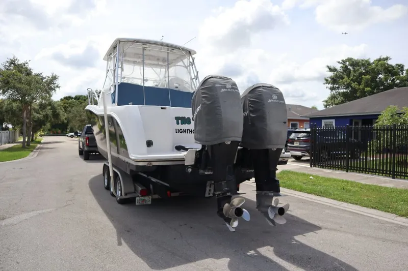 Slide: The Image of Pro-Line 32 Express 2007 boat on trailer with outboard motors. - 5