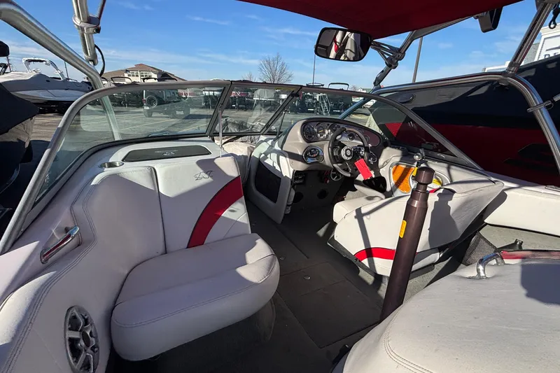 Slide: The Image of 2006 Nautique Ski Nautique 206 boat interior with steering wheel and seating. - 12