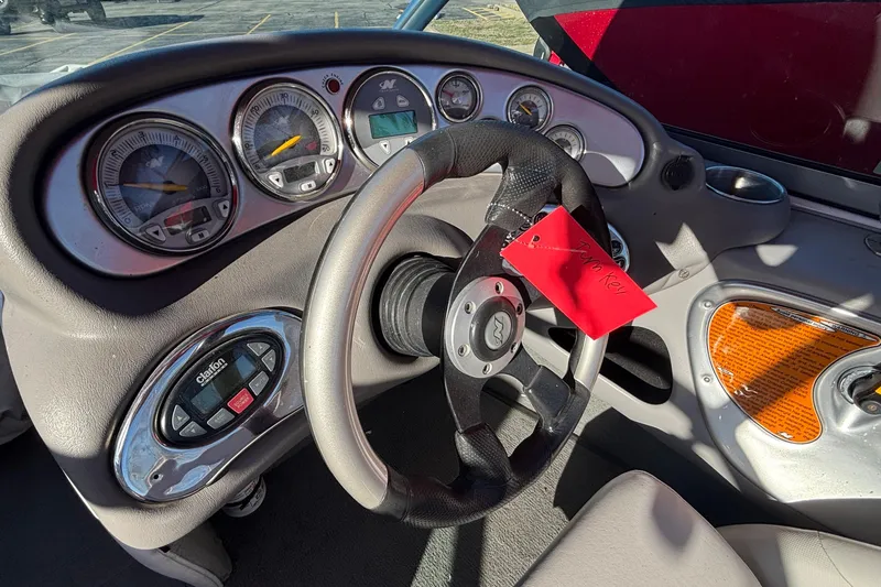 Slide: The Image of 2006 Nautique Ski Nautique 206 dashboard with steering wheel and gauges. - 14