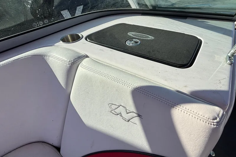 Slide: The Image of 2006 Nautique Ski Nautique 206 boat interior with logo and cup holder. - 20