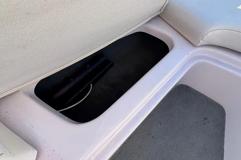 Slide: The Image of 2006 Nautique Ski Nautique 206 interior storage compartment with open lid. - 22
