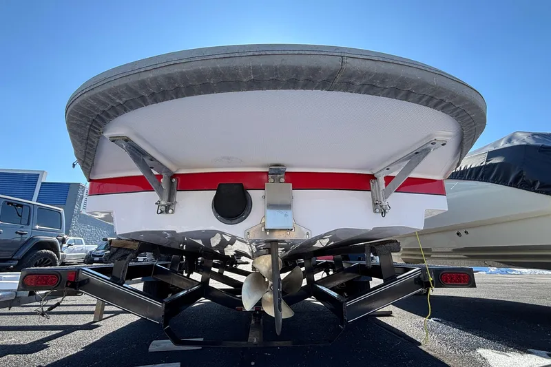 Slide: The Image of 2006 Nautique Ski Nautique 206 boat in parking lot, surrounded by other boats. - 3