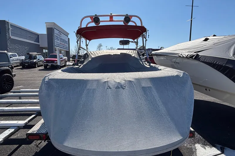 Slide: The Image of 2006 Nautique Ski Nautique 206 boat, red and white, on trailer, sunny day. - 4