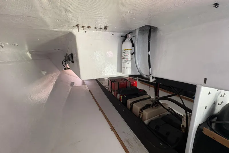 Slide: The Image of Interior of Antrim 40 boat showing battery compartment and fire extinguisher. - 19