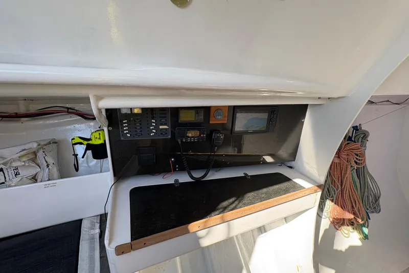 Slide: The Image of Navigation equipment and ropes inside an Antrim 40 sailboat cabin. - 15