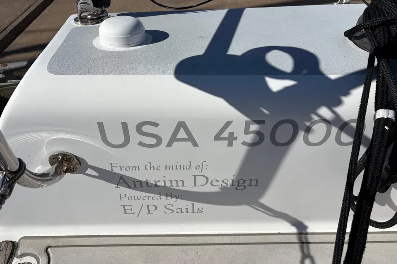 Slide: The Image of Antrim 40 sailboat with USA 45000 marking, featuring Antrim Design and E/P Sails branding. - 12