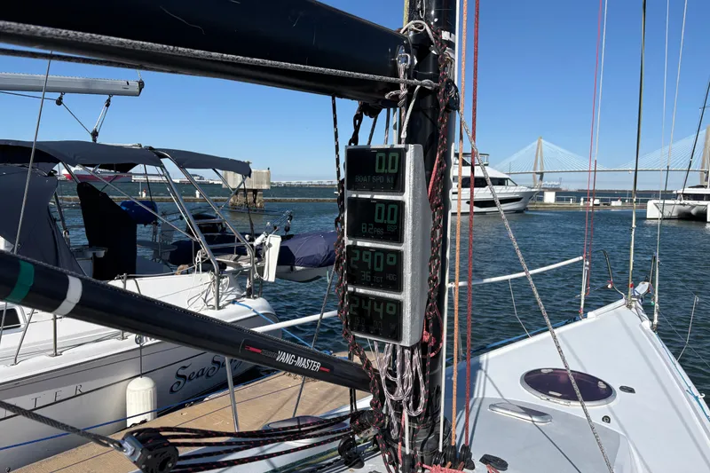 Slide: The Image of Sailboat Antrim 40 docked with digital navigation instruments, bridge in background. - 10