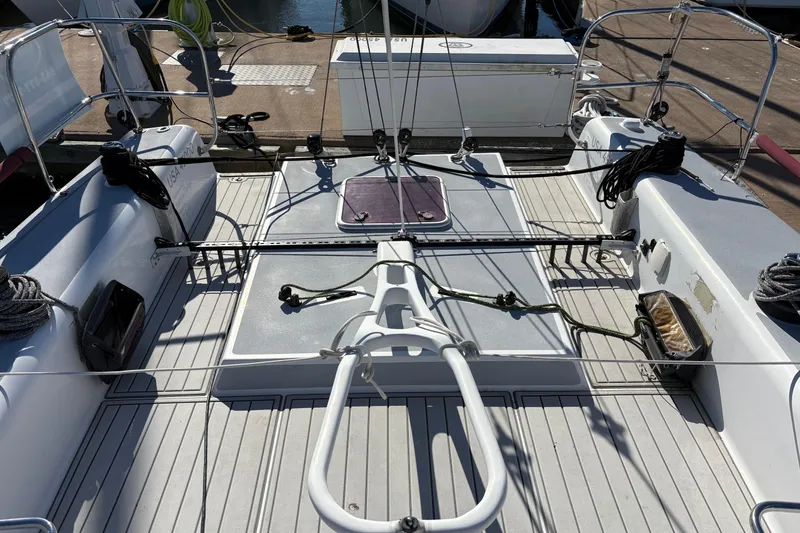 Slide: The Image of Antrim 40 sailboat deck with ropes and equipment at a marina. - 11