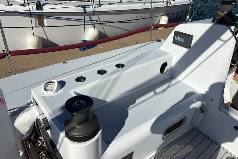 Slide: The Image of Cockpit of Antrim 40 sailboat with winch and compass, docked at marina. - 9