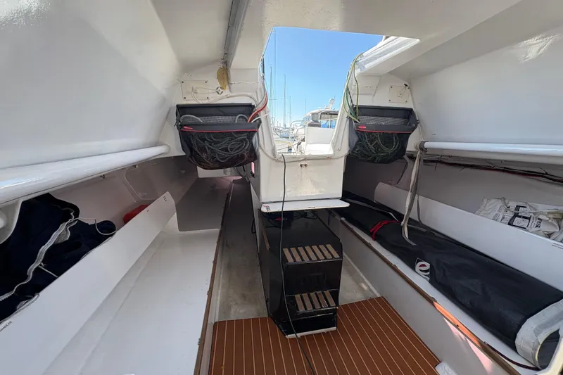 Slide: The Image of Interior view of Antrim 40 sailboat with storage compartments and seating. - 18