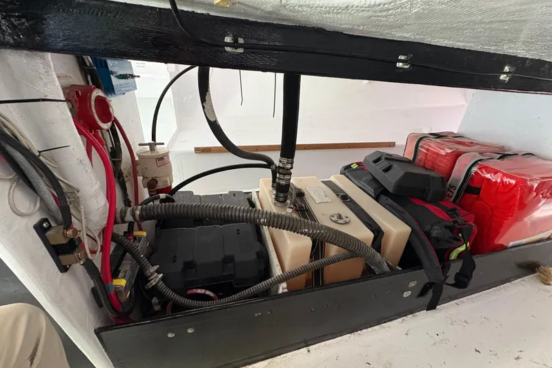 Slide: The Image of Interior view of Antrim 40 sailboat showing battery compartment and wiring. - 21