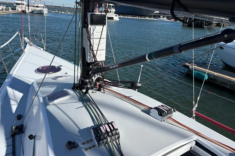 Slide: The Image of Sailboat Antrim 40 deck view with rigging and marina background. - 8