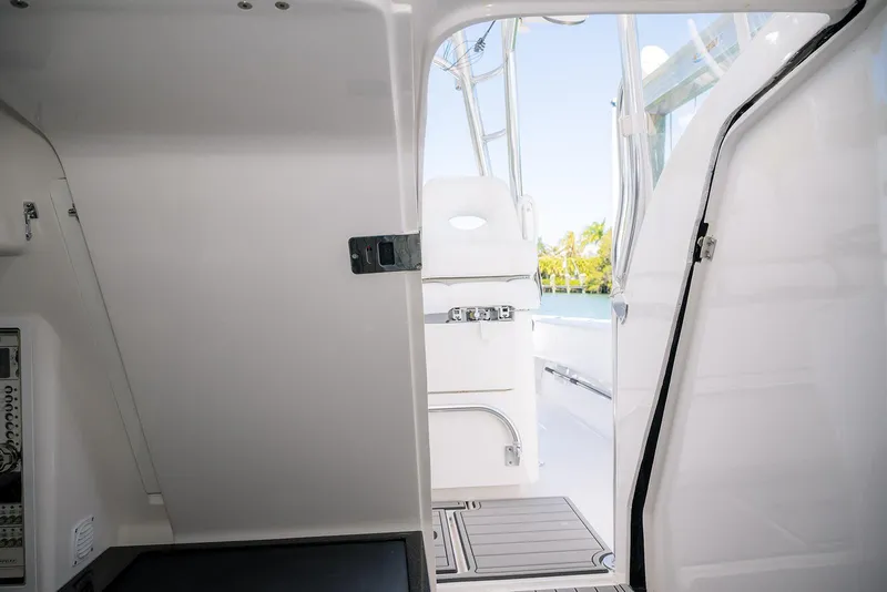 Slide: The Image of 2022 Contender 39 Fisharound interior view with open cabin door. - 14