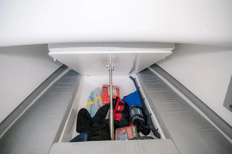 Slide: The Image of Interior storage of 2022 Contender 39 Fisharound boat with various gear and equipment. - 16