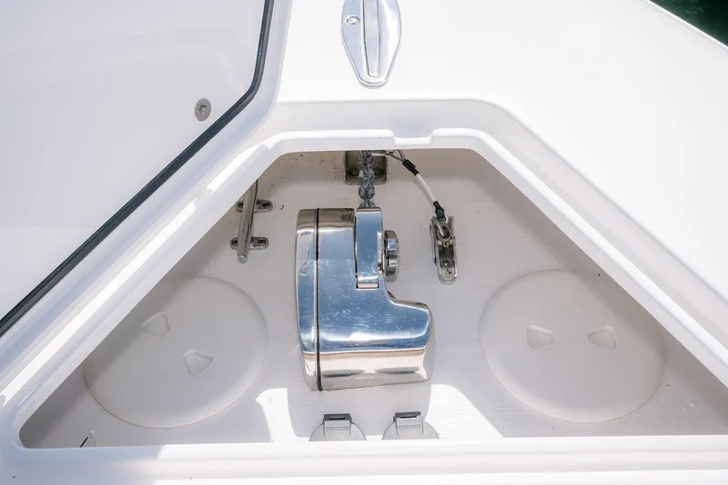 Slide: The Image of Anchor compartment of 2022 Contender 39 Fisharound boat, featuring polished metal components. - 20
