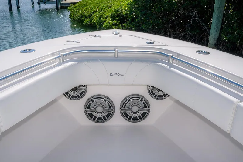 Slide: The Image of 2022 Contender 39 Fisharound boat interior with speakers and cushioned seating. - 22