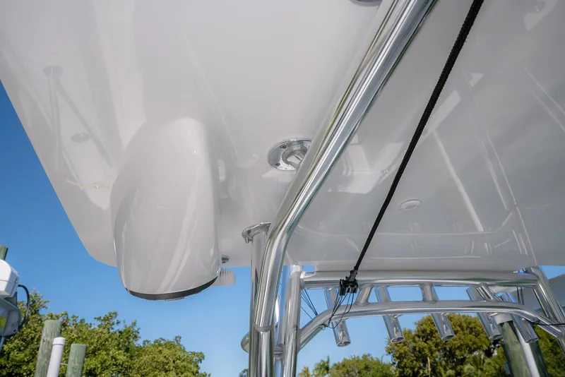 Slide: The Image of 2022 Contender 39 Fisharound boat with sleek design and polished metal framework. - 24