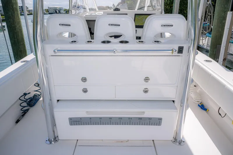 Slide: The Image of 2022 Contender 39 Fisharound boat interior with seating and storage compartments. - 29