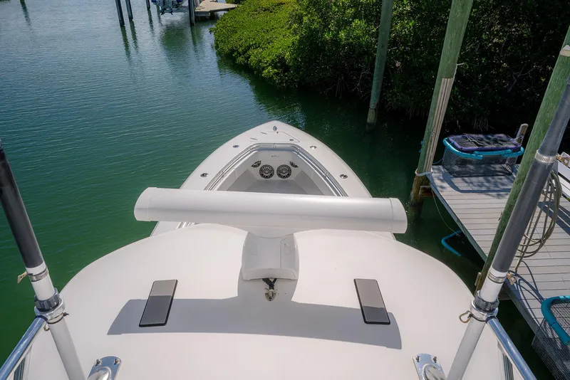 Slide: The Image of 2022 Contender 39 Fisharound boat docked in calm waters, aerial view. - 39
