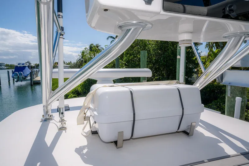 Slide: The Image of 2022 Contender 39 Fisharound boat with secured white storage box on deck. - 40