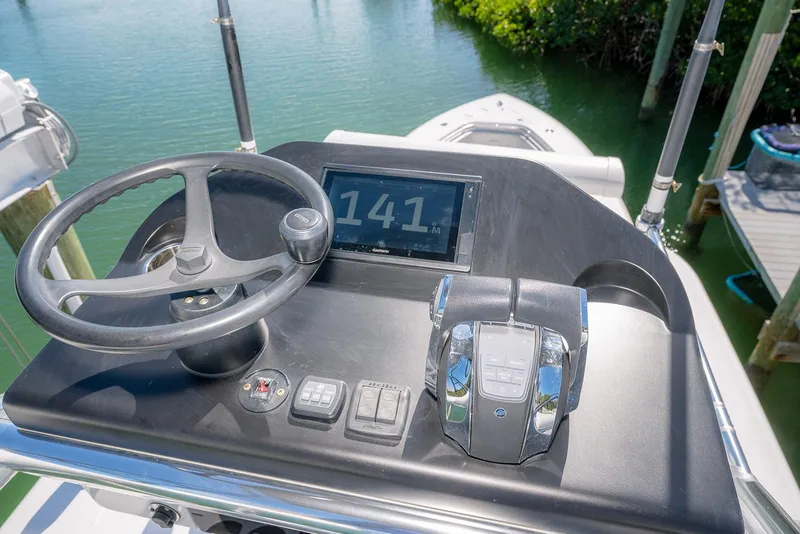 Slide: The Image of Helm of 2022 Contender 39 Fisharound with steering wheel and digital display. - 41