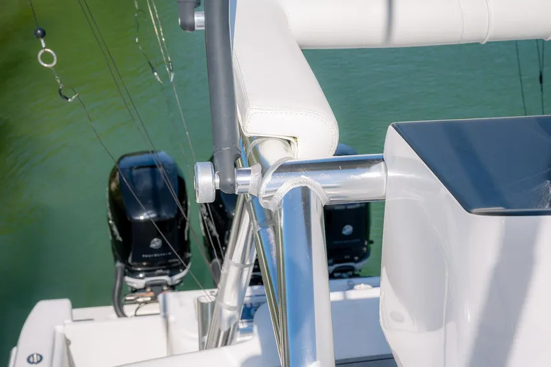 Slide: The Image of 2022 Contender 39 Fisharound boat with dual outboard motors and sleek railing design. - 45