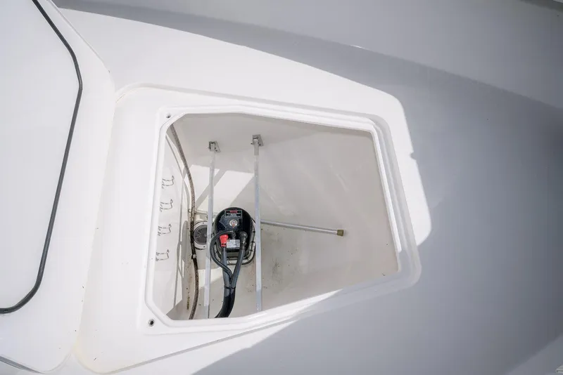 Slide: The Image of 2022 Contender 39 Fisharound storage compartment with equipment inside. - 47