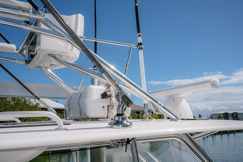 Slide: The Image of 2022 Contender 39 Fisharound boat with sleek metal framework and radar equipment. - 50