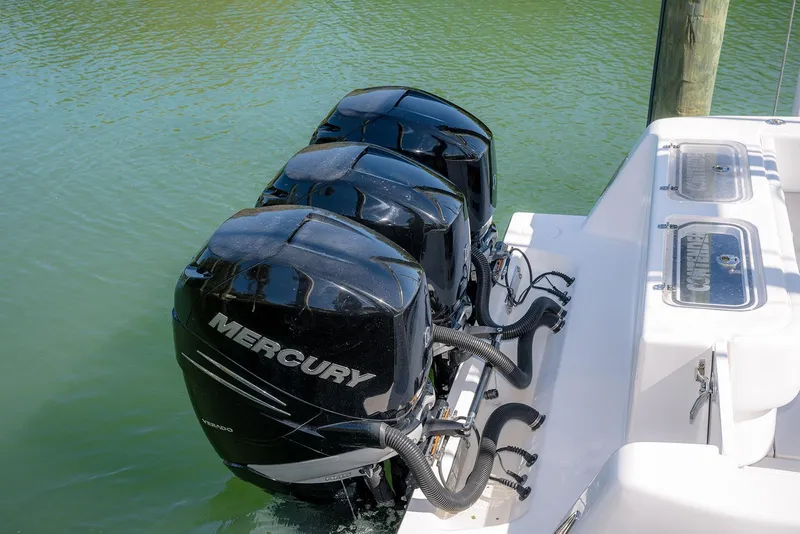 Slide: The Image of Triple Mercury outboard engines on 2022 Contender 39 Fisharound boat in water. - 57