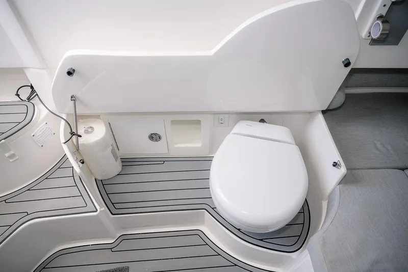Slide: The Image of 2022 Contender 39 Fisharound boat bathroom with modern toilet and sleek design. - 7